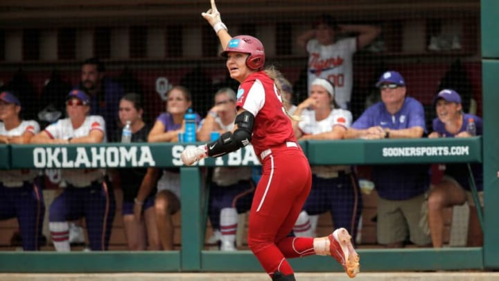 Oklahoma's Kinzie Hansen (9) celebrates her 3-run home run in the seventh inning during the NCAA Norman Super Regional softball game between the University of Oklahoma Sooners and the Clemson Tigers at Marita Hynes Field in Norman, Okla., Saturday, May, 27, 2023.