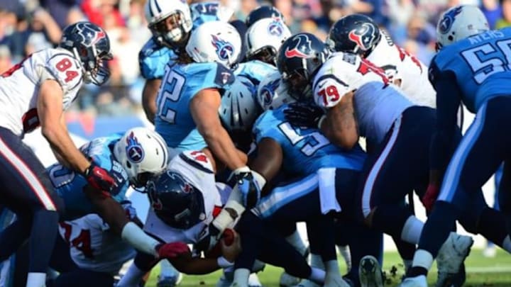 Dec 29, 2013; Nashville, TN, USA; Tennessee Titans linebacker Zach Brown (55) stops Houston Texans running back Jonathan grimes (41) during the second half at LP Field. The Titans won 16-10. Mandatory Credit: Don McPeak-USA TODAY Sports
