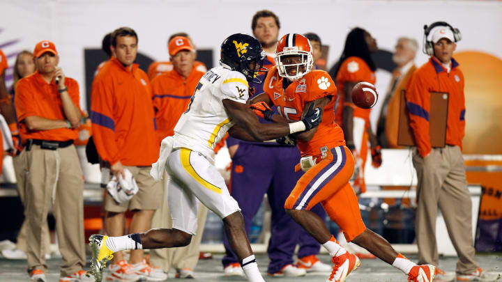 MIAMI GARDENS, FL – JANUARY 04: Ivan McCartney #5 of the West Virginia Mountaineers matches up against Coty Sensabaugh #15 of the Clemson Tigers during the Discover Orange Bowl at Sun Life Stadium on January 4, 2012 in Miami Gardens, Florida. (Photo by J. Meric/Getty Images)