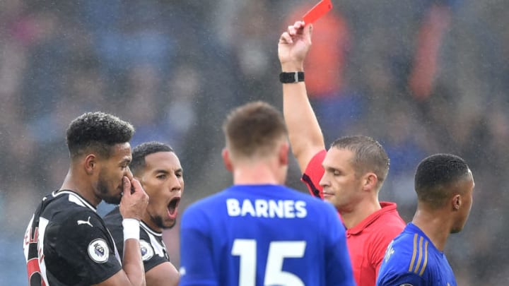 LEICESTER, ENGLAND - SEPTEMBER 29: Match referee Craig Pawson shows a red card to Isaac Hayden of Newcastle United during the Premier League match between Leicester City and Newcastle United at The King Power Stadium on September 29, 2019 in Leicester, United Kingdom. (Photo by Nathan Stirk/Getty Images)