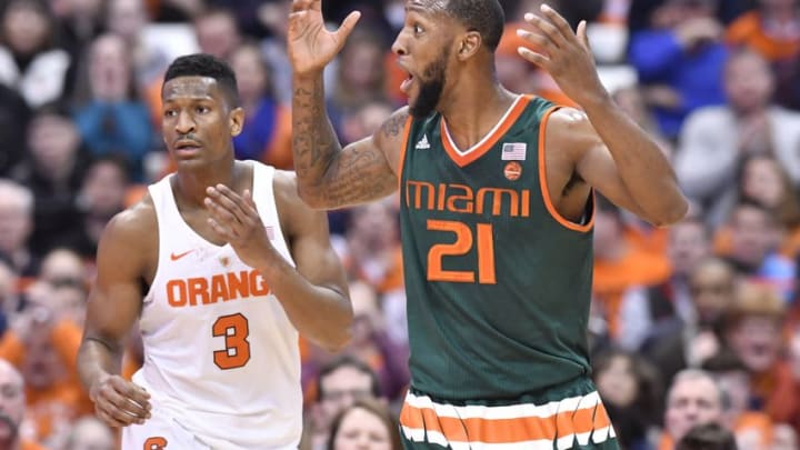 Jan 4, 2017; Syracuse, NY, USA; Miami Hurricanes forward Kamari Murphy (21) reacts to a called foul as Syracuse Orange guard Andrew White III (3) looks on during the second half at the Carrier Dome. Syracuse won 70-55. Mandatory Credit: Mark Konezny-USA TODAY Sports