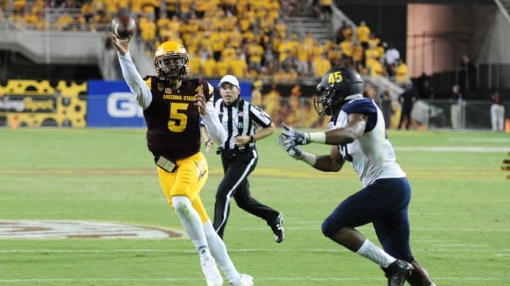 Sep 3, 2016; Tempe, AZ, USA; Arizona State Sun Devils quarterback Manny Wilkins (5) throws the ball to complete a two-point conversion as Northern Arizona Lumberjacks defensive end Clarence Smith (45) defends during the second half at Sun Devil Stadium. Mandatory Credit: Matt Kartozian-USA TODAY Sports