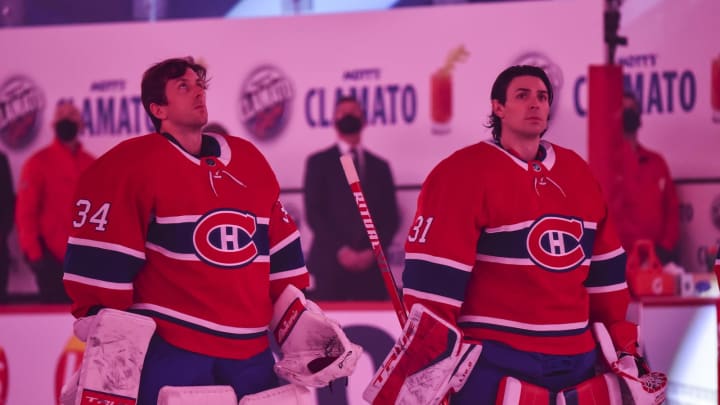 MONTREAL, QC – JANUARY 28: Goaltenders Jake Allen #34 (L) and Carey Price #31 of the Montreal Canadiens (R) look on during the pre-game ceremony prior to the home opening game against the Calgary Flames at the Bell Centre on January 28, 2021 in Montreal, Canada. The Montreal Canadiens defeated the Calgary Flames 4-2. (Photo by Minas Panagiotakis/Getty Images)
