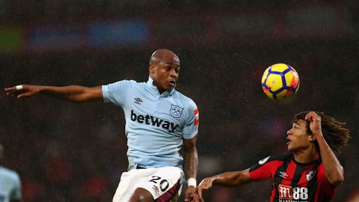 BOURNEMOUTH, ENGLAND - DECEMBER 26: Andre Ayew of West Ham United and Nathan Ake of AFC Bournemouth battle for possession in the air during the Premier League match between AFC Bournemouth and West Ham United at Vitality Stadium on December 26, 2017 in Bournemouth, England. (Photo by Steve Bardens/Getty Images)