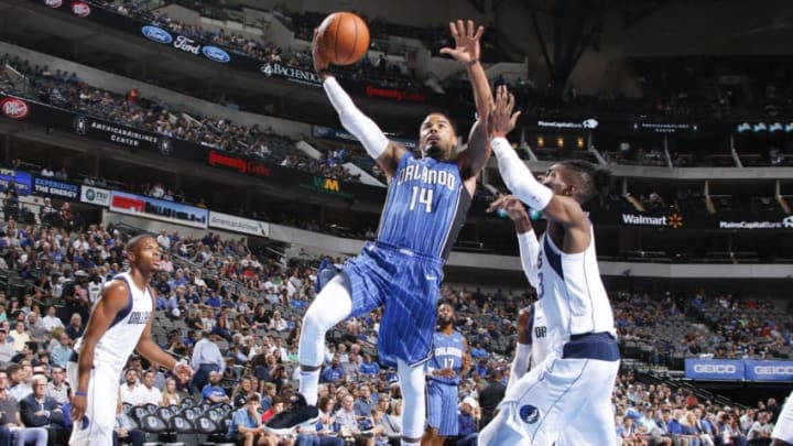 DALLAS, TX - OCTOBER 9: D.J. Augustin #14 of the Orlando Magic drives to the basket during a preseason game against the Dallas Mavericks on October 9, 2017 at the American Airlines Center in Dallas, Texas. NOTE TO USER: User expressly acknowledges and agrees that, by downloading and or using this photograph, User is consenting to the terms and conditions of the Getty Images License Agreement. Mandatory Copyright Notice: Copyright 2017 NBAE (Photo by Danny Bollinger/NBAE via Getty Images)