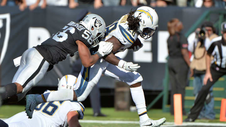 OAKLAND, CA - OCTOBER 15: Melvin Gordon #28 of the Los Angeles Chargers scores a six-yard touchdown against the Oakland Raiders during their NFL game at Oakland-Alameda County Coliseum on October 15, 2017 in Oakland, California. (Photo by Don Feria/Getty Images)