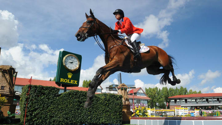 CALGARY, CANADA - SEPTEMBER 08: Beezie Madden of USA riding Simon competes in the individual jumping equestrian on the final day of the Masters tournament at Spruce Meadows on September 8, 2013 in Calgary, Alberta, Canada. Beezie placed 6th with a second round time of 71.27 seconds and 5 faults. (Photo by Derek Leung/Getty Images)