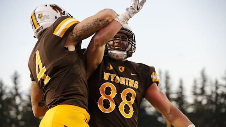 Oct 29, 2016; Laramie, WY, USA; Wyoming Cowboys tight end Jacob Hollister (88) celebrates his touchdown against the Boise State Broncos during the second quarter at War Memorial Stadium. Mandatory Credit: Troy Babbitt-USA TODAY Sports Oct 29, 2016; Laramie, WY, USA; Wyoming Cowboys tight end Jacob Hollister (88) celebrates his touchdown against the Boise State Broncos during the second quarter at War Memorial Stadium. Mandatory Credit: Troy Babbitt-USA TODAY Sports