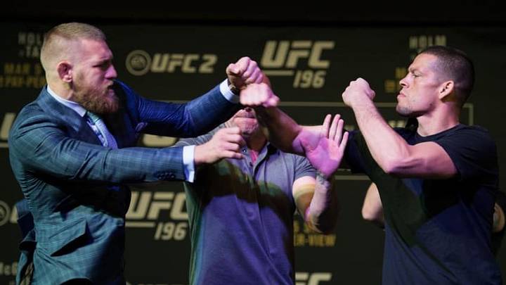 LAS VEGAS, NV - MARCH 3: (L-R) UFC featherweight champion Conor McGregor throws a punch towards Nate Diaz during the UFC 196 Press Conference at David Copperfield Theater in the MGM Grand Hotel/Casino on March 3, 2016 in Las Vegas, Nevada. (Photo by Brandon Magnus/Zuffa LLC/Zuffa LLC via Getty Images)