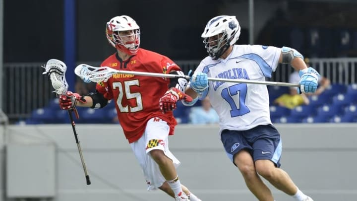 May 17, 2015; Annapolis, MD, USA; Maryland Terrapins attack Dylan Maltz (25) moves the ball as North Carolina Tar Heels defense Ryan Kilpatrick (15) defends during the second half at Navy Marine Corps Memorial Stadium. Maryland Terrapins defeated North Carolina Tar Heels 14-7. Mandatory Credit: Tommy Gilligan-USA TODAY Sports