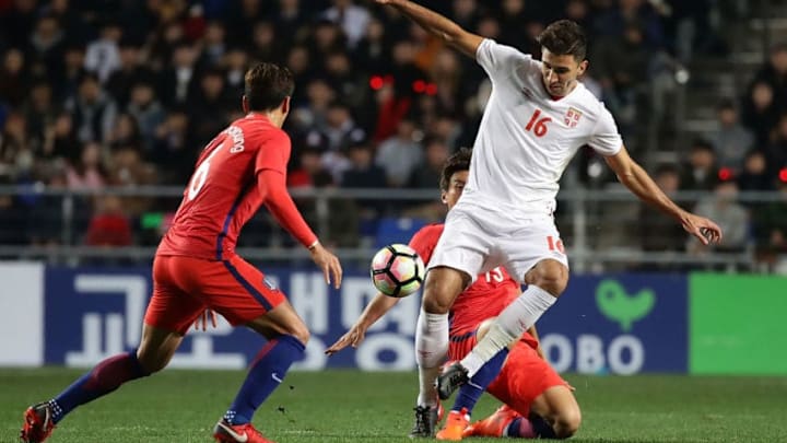 ULSAN, SOUTH KOREA - NOVEMBER 14: Marko Grujic of Serbia competes for the ball with Jung Woo-Young of South Korea during the international friendly match between South Korea and Serbia at Ulsan World Cup Stadium on November 14, 2017 in Ulsan, South Korea. (Photo by Chung Sung-Jun/Getty Images)