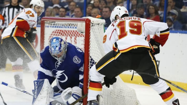 Tampa, FL - FEBRUARY 23: Tampa Bay Lightning goalie Andrei Vasilevskiy (88) blocks the shot from Calgary Flames left wing Matthew Tkachuk (19) in the second period of the NHL game between the Calgary Flames and Tampa Bay Lightning on February 23, 2017, at Amalie Arena in Tampa, FL. (Photo by Mark LoMoglio/Icon Sportswire via Getty Images)