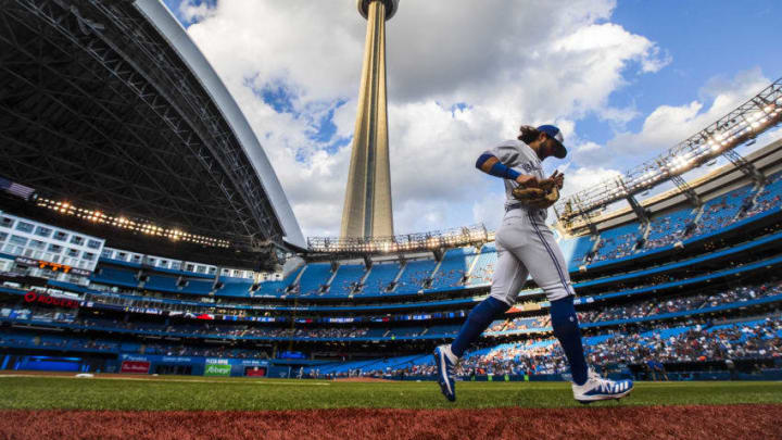 TORONTO, ONTARIO - AUGUST 9: Bo Bichette #11 of the Toronto Blue Jays runs on the field prior to the playing against the New York Yankees during their MLB game at the Rogers Centre on August 9, 2019 in Toronto, Canada. (Photo by Mark Blinch/Getty Images)