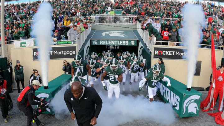 EAST LANSING, MICHIGAN - OCTOBER 08: Head coach Mel Tucker of the Michigan State Spartans leads his team onto the field to play the Ohio State Buckeyes at Spartan Stadium on October 08, 2022 in East Lansing, Michigan. (Photo by Gregory Shamus/Getty Images)