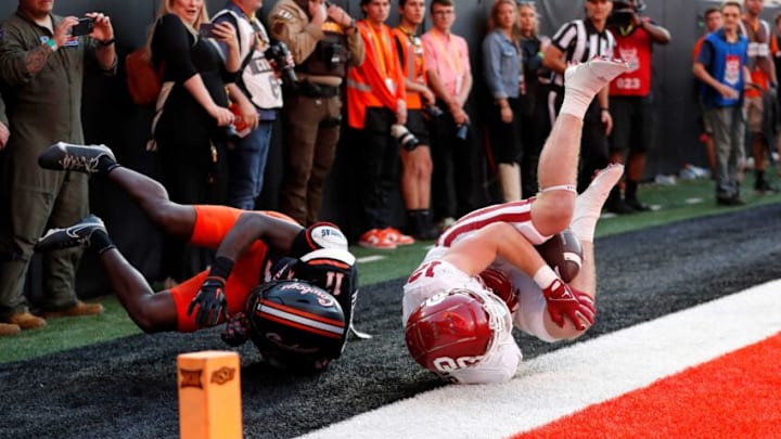Oklahoma's Drake Stoops (12) is unable to make a completion as Oklahoma State's Dylan Smith (11) defends in the second half during a Bedlam college football game between the Oklahoma State University Cowboys (OSU) and the University of Oklahoma Sooners (OU) at Boone Pickens Stadium in Stillwater, Okla., Saturday, Nov. 4, 2023.