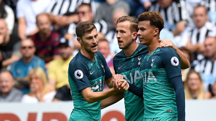 NEWCASTLE UPON TYNE, ENGLAND - AUGUST 11: Dele Alli of Tottenham Hotspur celebrates with teammates Harry Kane and Ben Davies after scoring his team's second goal during the Premier League match between Newcastle United and Tottenham Hotspur at St. James Park on August 11, 2018 in Newcastle upon Tyne, United Kingdom. (Photo by Tony Marshall/Getty Images)