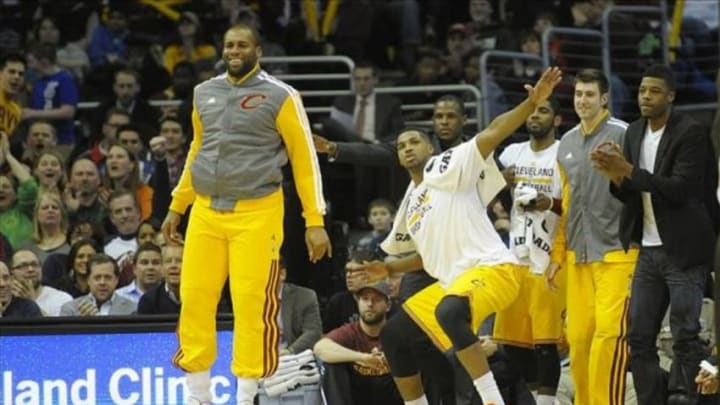 Feb 23, 2014; Cleveland, OH, USA; Cleveland Cavaliers center Arinze Onuaku (left) and power forward Tristan Thompson (second from left) celebrate on the bench in the fourth quarter against the Washington Wizards at Quicken Loans Arena. Mandatory Credit: David Richard-USA TODAY Sports