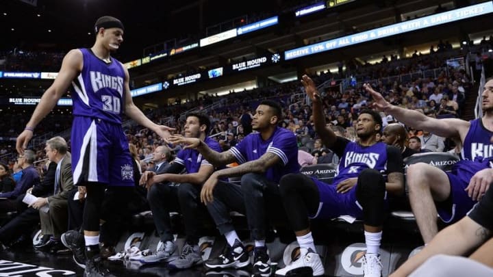 Apr 11, 2016; Phoenix, AZ, USA; Sacramento Kings guard Seth Curry (30) is congratulated by teammates in the first half of the game against the Phoenix Suns at Talking Stick Resort Arena. Mandatory Credit: Jennifer Stewart-USA TODAY Sports