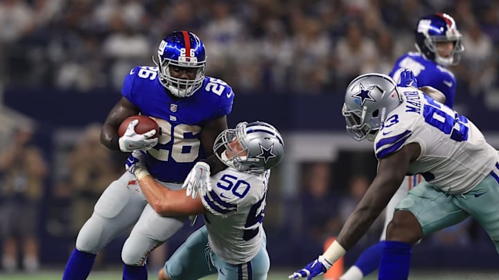 ARLINGTON, TX – SEPTEMBER 10: Orleans Darkwa #26 of the New York Giants gets stopped by Sean Lee #50 of the Dallas Cowboys in the second half of a game at AT&T Stadium on September 10, 2017 in Arlington, Texas. (Photo by Ronald Martinez/Getty Images)