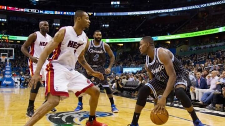 Jan 4, 2014; Orlando, FL, USA; Miami Heat power forward Rashard Lewis (9) defends Orlando Magic small forward Maurice Harkless (21) during the second half of the game at the Amway Center. Mandatory Credit: Rob Foldy-USA TODAY Sports