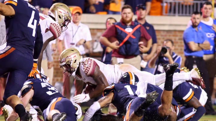CHARLOTTESVILLE, VA – SEPTEMBER 14: Cam Akers #3 of the Florida State Seminoles is stopped short of the goal line on the final play of the second half during a game against the Virginia Cavaliers at Scott Stadium on September 14, 2019 in Charlottesville, Virginia. (Photo by Ryan M. Kelly/Getty Images)