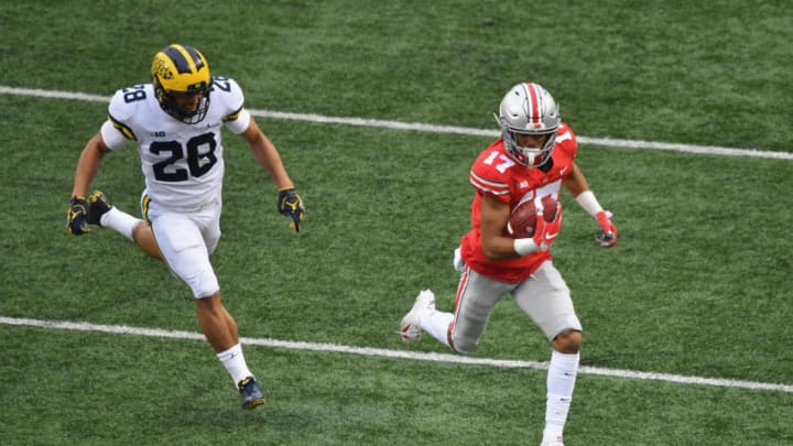 COLUMBUS, OH - NOVEMBER 24: Chris Olave #17 of the Ohio State Buckeyes outruns Brandon Watson #28 of the Michigan Wolverines for a 24-yard touchdown catch in the first quarter at Ohio Stadium on November 24, 2018 in Columbus, Ohio. (Photo by Jamie Sabau/Getty Images)