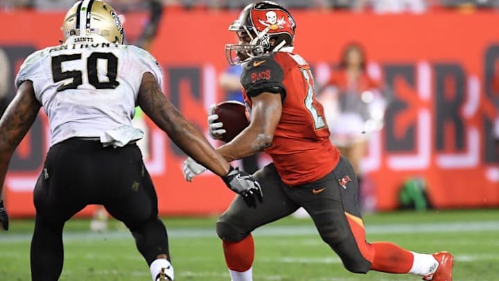 Dec 11, 2016; Tampa, FL, USA; Tampa Bay Buccaneers running back Doug Martin (22) runs the ball in the second half against the New Orleans Saints at Raymond James Stadium. The Tampa Bay Buccaneers defeated the New Orleans Saints 16-11. Mandatory Credit: Jonathan Dyer-USA TODAY Sports