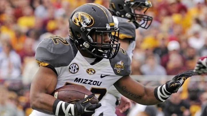 Jan 1, 2015; Orlando, FL, USA; Missouri Tigers running back Russell Hansbrough (32) runs the ball against the Minnesota Golden Gophers in the first quarter of the 2015 Citrus Bowl at Florida Citrus Bowl. Mandatory Credit: David Manning-USA TODAY Sports