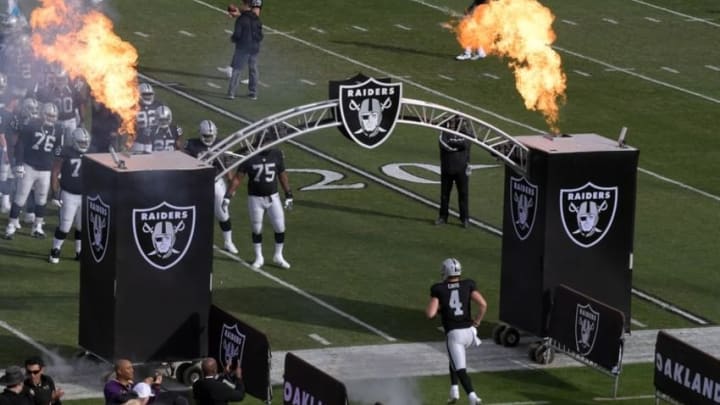 Nov 27, 2016; Oakland, CA, USA; Oakland Raiders quarterback Derek Carr (4) is introduced before playing against the Carolina Panthers at Oakland-Alameda County Coliseum. Mandatory Credit: Kirby Lee-USA TODAY Sports