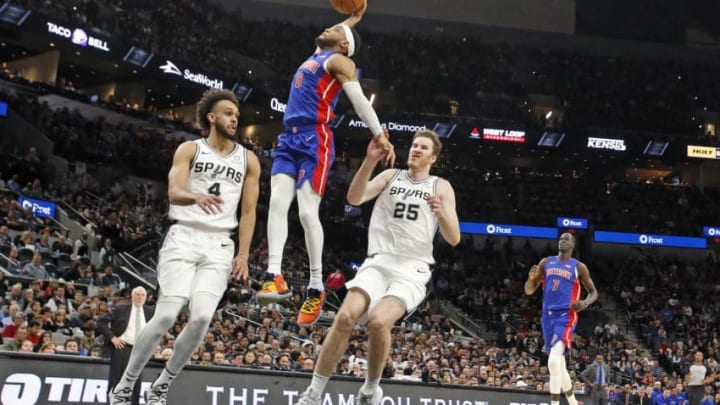 SAN ANTONIO, TX - DECEMBER 28: Bruce Brown #6 of the Detroit Pistons dunks past Derrick White #4 of the San Antonio Spurs during second half action at AT&T Center on December 28, 2019 in San Antonio, Texas. San Antonio Spurs defeated the Detroit Pistons 136-109. NOTE TO USER: User expressly acknowledges and agrees that , by downloading and or using this photograph, User is consenting to the terms and conditions of the Getty Images License Agreement. (Photo by Ronald Cortes/Getty Images)