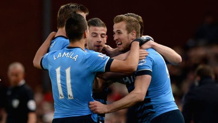 Harry Kane of Tottenham Hotspur (10) celebrates with team mates as he scores their first goal during the Barclays Premier League match between Stoke City and Tottenham Hotspur at the Britannia Stadium on April 18, 2016 in Stoke on Trent, England.