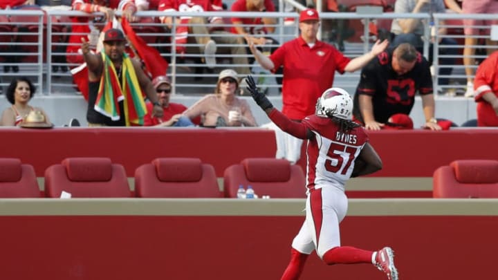 SANTA CLARA, CA - OCTOBER 07: Josh Bynes #57 of the Arizona Cardinals celebrates after scoring on a strip sack of C.J. Beathard #3 of the San Francisco 49ers during their NFL game at Levi's Stadium on October 7, 2018 in Santa Clara, California. (Photo by Jason O. Watson/Getty Images)
