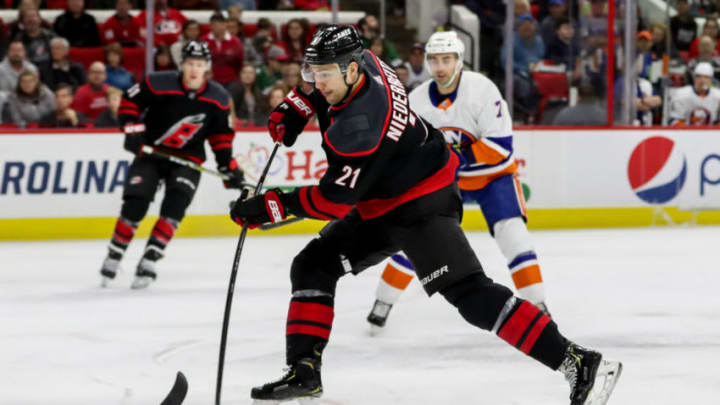 RALEIGH, NC - JANUARY 19: Carolina Hurricanes Right Wing Nino Niederreiter (21) steps into a shot during an NHL game between the Carolina Hurricanes and New York Islanders on January 19, 2020 at the PNC Arena in Raleigh, NC. (Photo by John McCreary/Icon Sportswire via Getty Images)