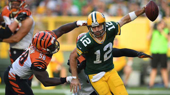 GREEN BAY, WI - SEPTEMBER 24: Aaron Rodgers #12 of the Green Bay Packers is sacked by Carl Lawson #58 and Chris Smith #94 of the Cincinnati Bengals during the third quarter at Lambeau Field on September 24, 2017 in Green Bay, Wisconsin. (Photo by Stacy Revere/Getty Images)