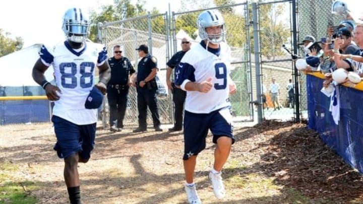 Jul 30, 2015; Oxnard, CA, USA; Dallas Cowboys quarterback Tony Romo (9) and wide receiver Dez Bryant (88) run on to the field for the first day of training camp at River Ridge Fields. Mandatory Credit: Jayne Kamin-Oncea-USA TODAY Sports