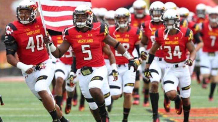 Aug 30, 2014; College Park, MD, USA; Maryland Terrapins running back Albert Reid (5), linebacker Matt Robinson (40) and wide receiver Jacquille Veii (34) lead the team onto the field prior to the game against the James Madison Dukes at Byrd Stadium. Mandatory Credit: Mitch Stringer-USA TODAY Sports