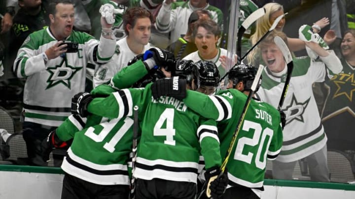 Apr 19, 2023; Dallas, Texas, USA; Dallas Stars center Roope Hintz (24) and center Tyler Seguin (91) and defenseman Miro Heiskanen (4) and defenseman Ryan Suter (20) celebrates after Hintz scores his second goal against Minnesota Wild goaltender Marc-Andre Fleury (not pictured) during the second period in game two of the first round of the 2023 Stanley Cup Playoffs at American Airlines Center. Mandatory Credit: Jerome Miron-USA TODAY Sports