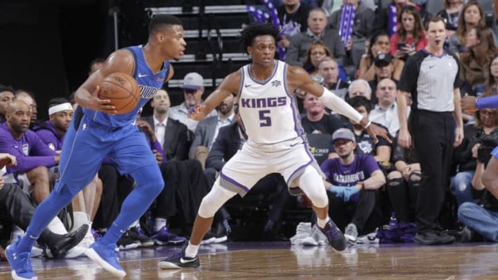 SACRAMENTO, CA - MARCH 27: Dennis Smith Jr. #1 of the Dallas Mavericks handles the ball against De'Aaron Fox #5 of the Sacramento Kings on March 27, 2018 at Golden 1 Center in Sacramento, California. NOTE TO USER: User expressly acknowledges and agrees that, by downloading and or using this photograph, User is consenting to the terms and conditions of the Getty Images Agreement. Mandatory Copyright Notice: Copyright 2018 NBAE (Photo by Rocky Widner/NBAE via Getty Images)