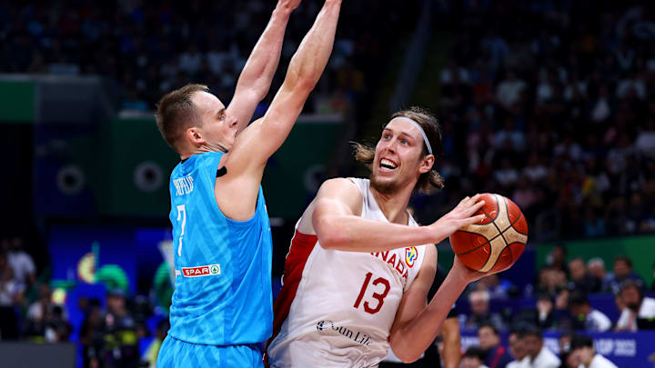 MANILA, PHILIPPINES – SEPTEMBER 06: Kelly Olynyk #13 of Canada shoots the ball against Klemen Prepelic #7 of Slovenia in the third quarter during the FIBA Basketball World Cup quarterfinal game at Mall of Asia Arena on September 06, 2023 in Manila, Philippines. (Photo by Yong Teck Lim/Getty Images)