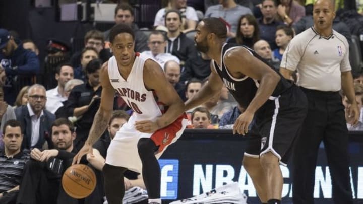Feb 4, 2015; Toronto, Ontario, CAN; Toronto Raptors guard DeMar DeRozan (10) dribbles as Brooklyn Nets guard Alan Anderson (6) tries to defend during the third quarter in a game at Air Canada Centre The Brooklyn Nets won 109-93. Mandatory Credit: Nick Turchiaro-USA TODAY Sports