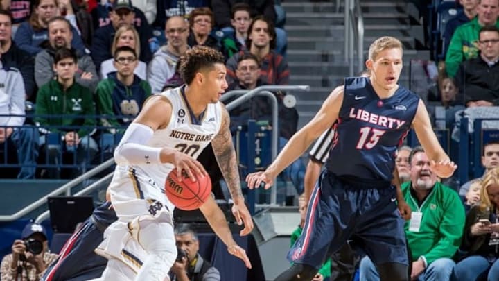 Dec 29, 2015; South Bend, IN, USA; Notre Dame Fighting Irish forward Zach Auguste (30) drives to the basket as Liberty Flames center Evan Maxwell (15) defends in the first half at the Purcell Pavilion. Notre Dame won 73-56. Mandatory Credit: Matt Cashore-USA TODAY Sports Dec 29, 2015; South Bend, IN, USA; Notre Dame Fighting Irish forward Zach Auguste (30) drives to the basket as Liberty Flames center Evan Maxwell (15) defends in the first half at the Purcell Pavilion. Notre Dame won 73-56. Mandatory Credit: Matt Cashore-USA TODAY Sports