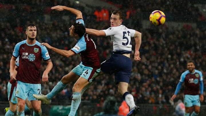 Tottenham Hotspur's English midfielder Oliver Skipp (R) goes up against Burnley's English midfielder Jack Cork (2L) during the English Premier League football match between Tottenham Hotspur and Burnley at Wembley Stadium in London on December 15, 2018. (Photo by Adrian DENNIS / AFP) / RESTRICTED TO EDITORIAL USE. No use with unauthorized audio, video, data, fixture lists, club/league logos or 'live' services. Online in-match use limited to 120 images. An additional 40 images may be used in extra time. No video emulation. Social media in-match use limited to 120 images. An additional 40 images may be used in extra time. No use in betting publications, games or single club/league/player publications. / (Photo credit should read ADRIAN DENNIS/AFP/Getty Images)