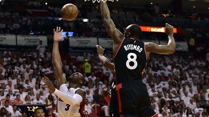 May 7, 2016; Miami, FL, USA; Miami Heat guard Dwyane Wade (3) drives to the basket as Toronto Raptors center Bismack Biyombo (8) defends during the third quarter in game three of the second round of the NBA Playoffs at American Airlines Arena. Mandatory Credit: Steve Mitchell-USA TODAY Sports