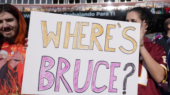 LANDOVER, MD - DECEMBER 22: A fan holds a sign for Washington Redskins team president Bruce Allen in the first half during a game against the New York Giants at FedExField on December 22, 2019 in Landover, Maryland. (Photo by Patrick McDermott/Getty Images)