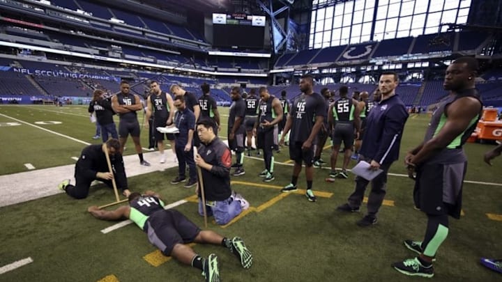 Feb 28, 2016; Indianapolis, IN, USA; Stony Brook defensive lineman Victor Ochi gets measured during the 2016 NFL Scouting Combine at Lucas Oil Stadium. Mandatory Credit: Brian Spurlock-USA TODAY Sports