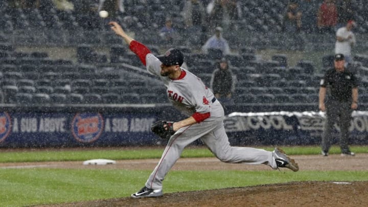 NEW YORK, NEW YORK - JUNE 02: Matt Barnes #32 of the Boston Red Sox pitches in the rain during the eighth inning against the New York Yankees at Yankee Stadium on June 02, 2019 in New York City. (Photo by Jim McIsaac/Getty Images)