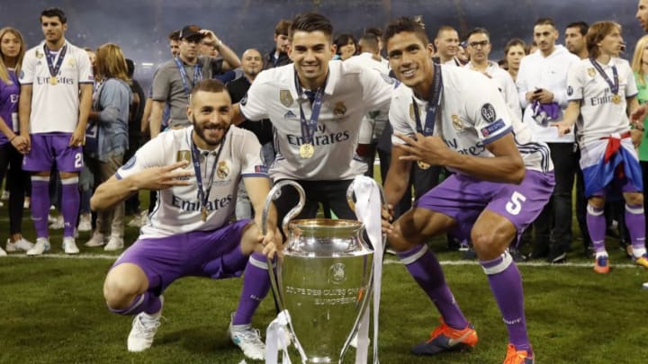 (L-R) Karim Benzema of Real Madrid, Enzo Fernandez of Real Madrid, Raphael Varane of Real Madrid with Champions League trophy, Coupe des clubs Champions Europeensduring the UEFA Champions League final match between Juventus FC and Real Madrid on June 3, 2017 at the Millennium Stadium in Cardiff, Wales(Photo by VI Images via Getty Images)