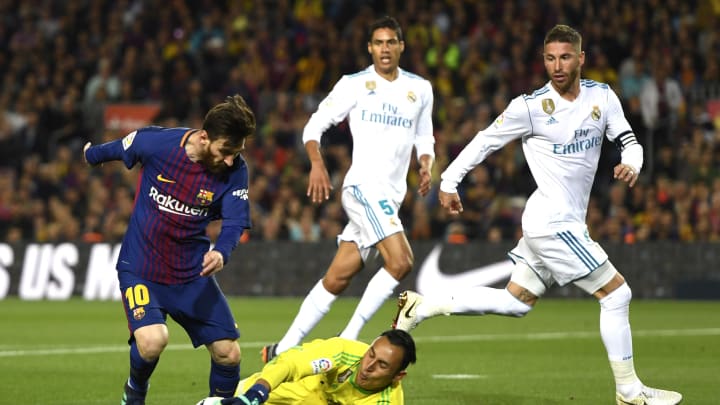 BARCELONA, SPAIN – MAY 06: Lionel Messi of Barcelona is foiled by Keylor Navas of Real Madrid during the La Liga match between Barcelona and Real Madrid at Camp Nou on May 6, 2018 in Barcelona, Spain. (Photo by Alex Caparros/Getty Images)