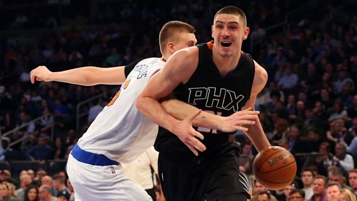 Jan 29, 2016; New York, NY, USA; New York Knicks forward Kristaps Porzingis (6) upsets the ball on Phoenix Suns center Alex Len (21) during the second quarter at Madison Square Garden. Mandatory Credit: Anthony Gruppuso-USA TODAY Sports
