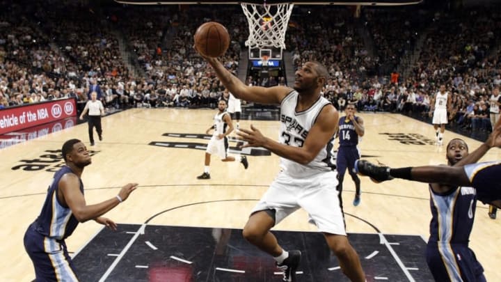 Apr 19, 2016; San Antonio, TX, USA; San Antonio Spurs center Boris Diaw (33) shoots the ball past Memphis Grizzlies small forward Lance Stephenson (1, right) in game two of the first round of the NBA Playoffs at AT&T Center. Mandatory Credit: Soobum Im-USA TODAY Sports